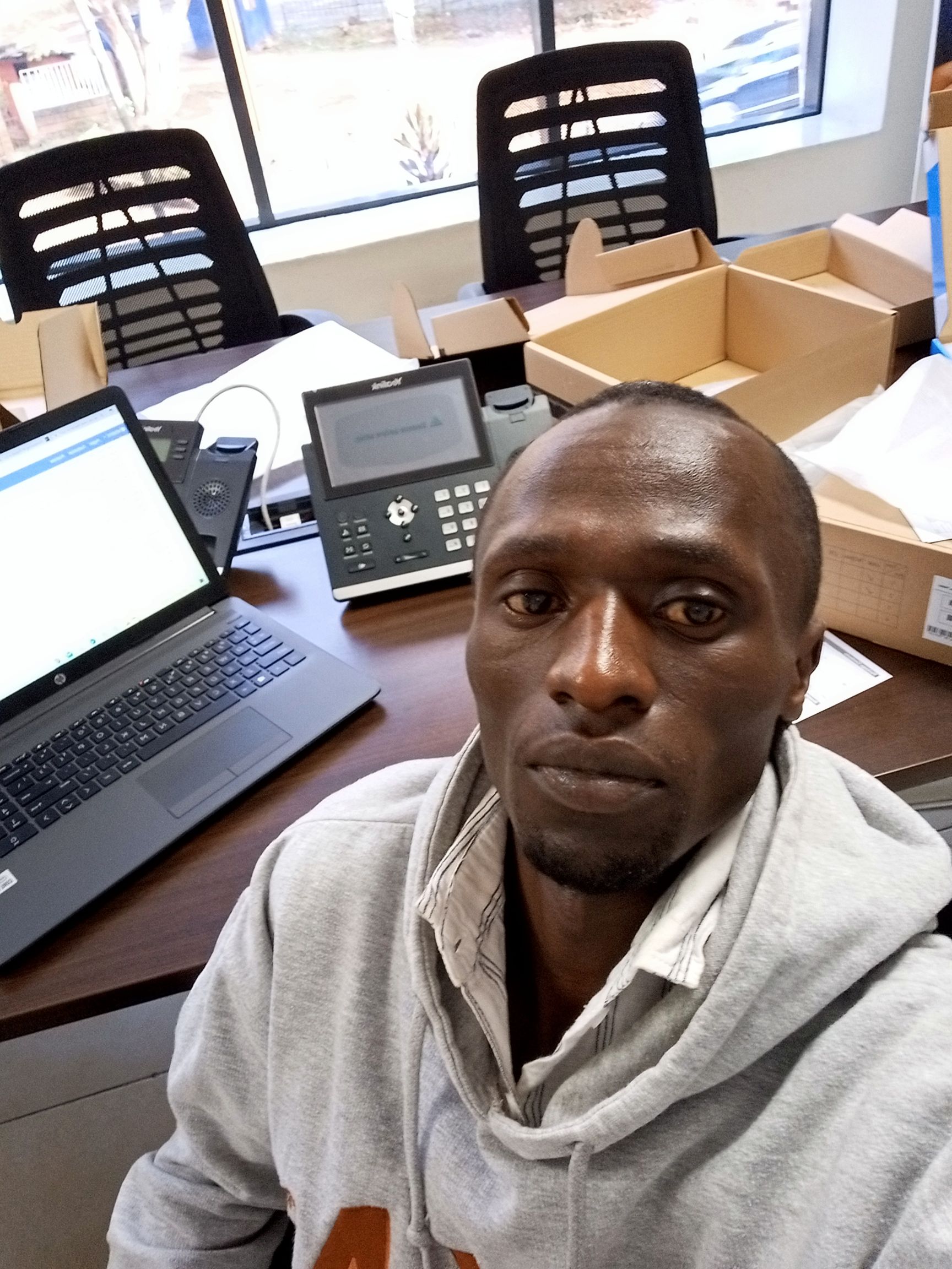 engineers at work instlling VoIP IP PBX systems